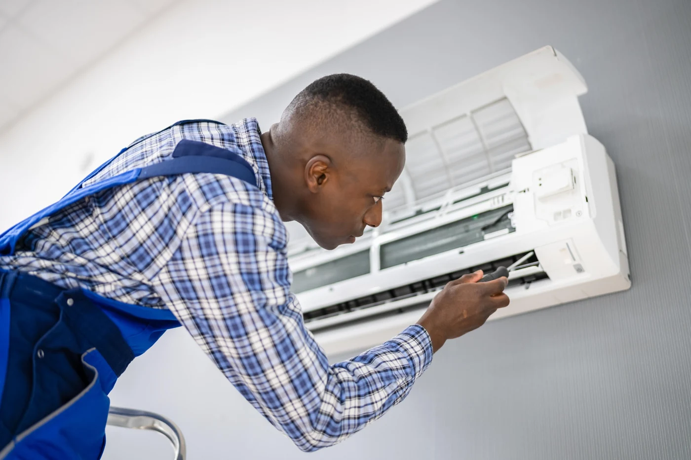 Dedicated air-conditioner circuit and electrical supply work in Gauteng Electrician repairing and checking air-conditioning electrical wiring