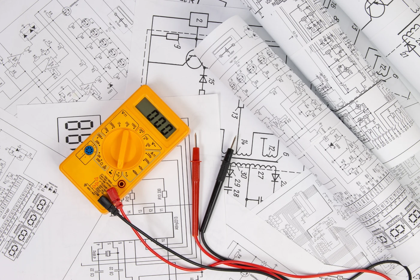 Digital multimeter and electrical drawings used for DB board earth leakage testing
