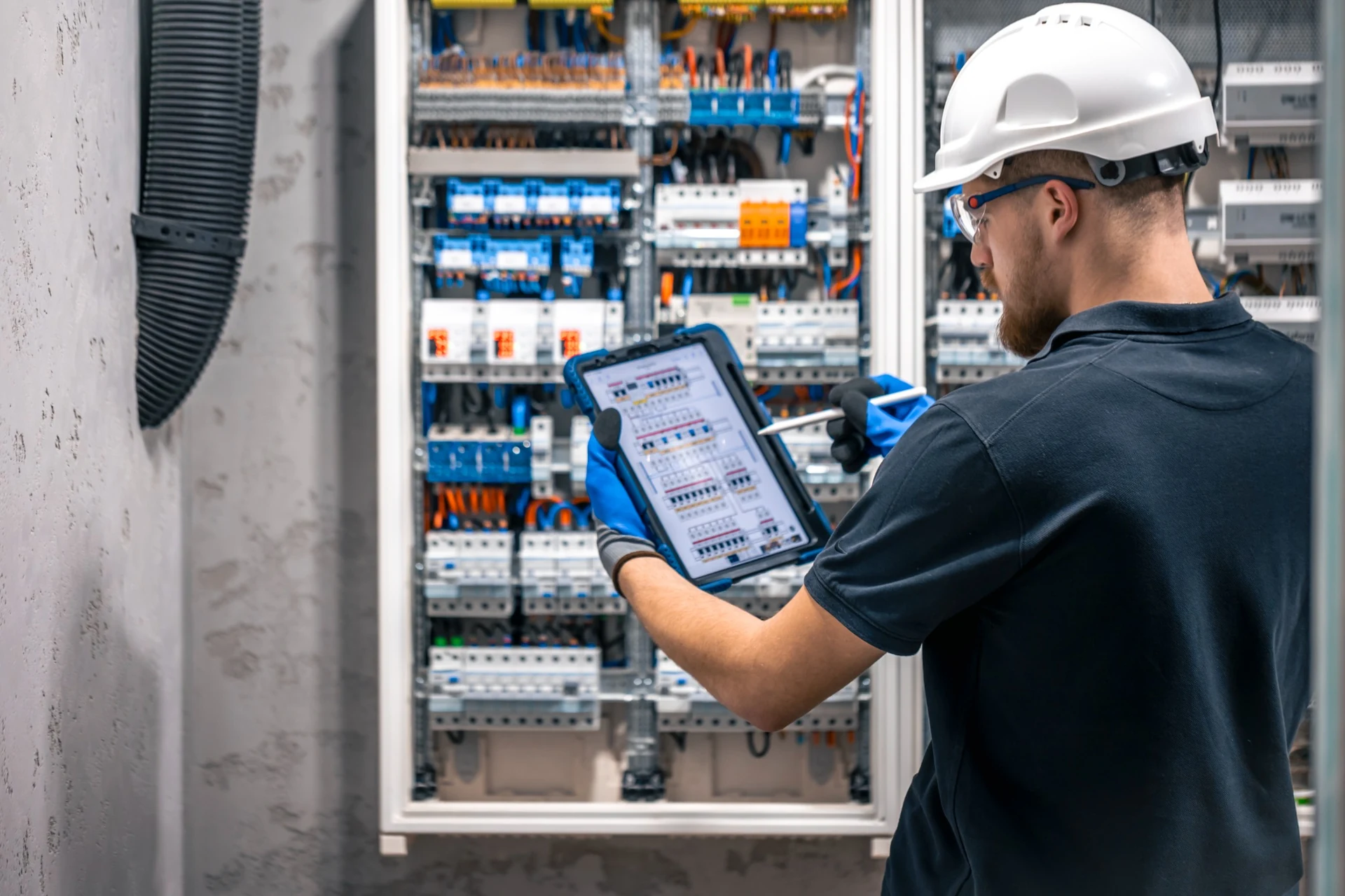 Electrician carrying out a digital DB board inspection for an electrical COC in Gauteng