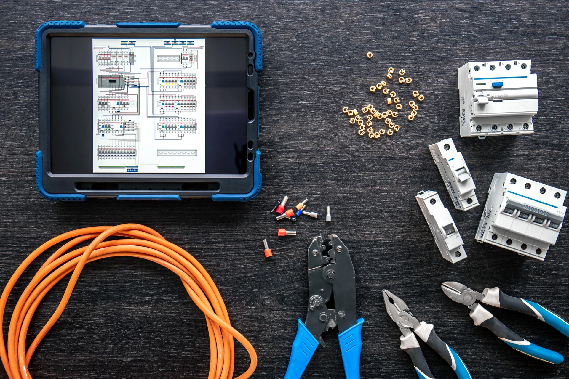 Electrical testing tools, circuit breakers and digital plans used for residential COC inspection support