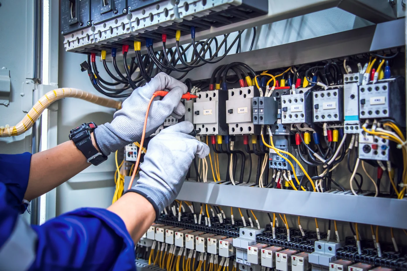 DB board voltage testing and electrical maintenance in Gauteng Electrician using a voltmeter to test circuit breaker terminals during DB board maintenance