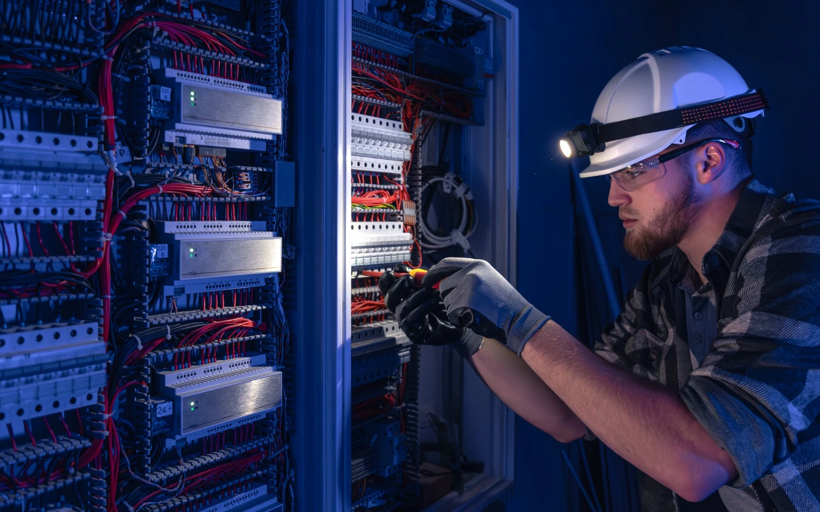 Lighting circuit electrical maintenance and testing in Gauteng Electrician testing electrical circuits and protection equipment during lighting maintenance work