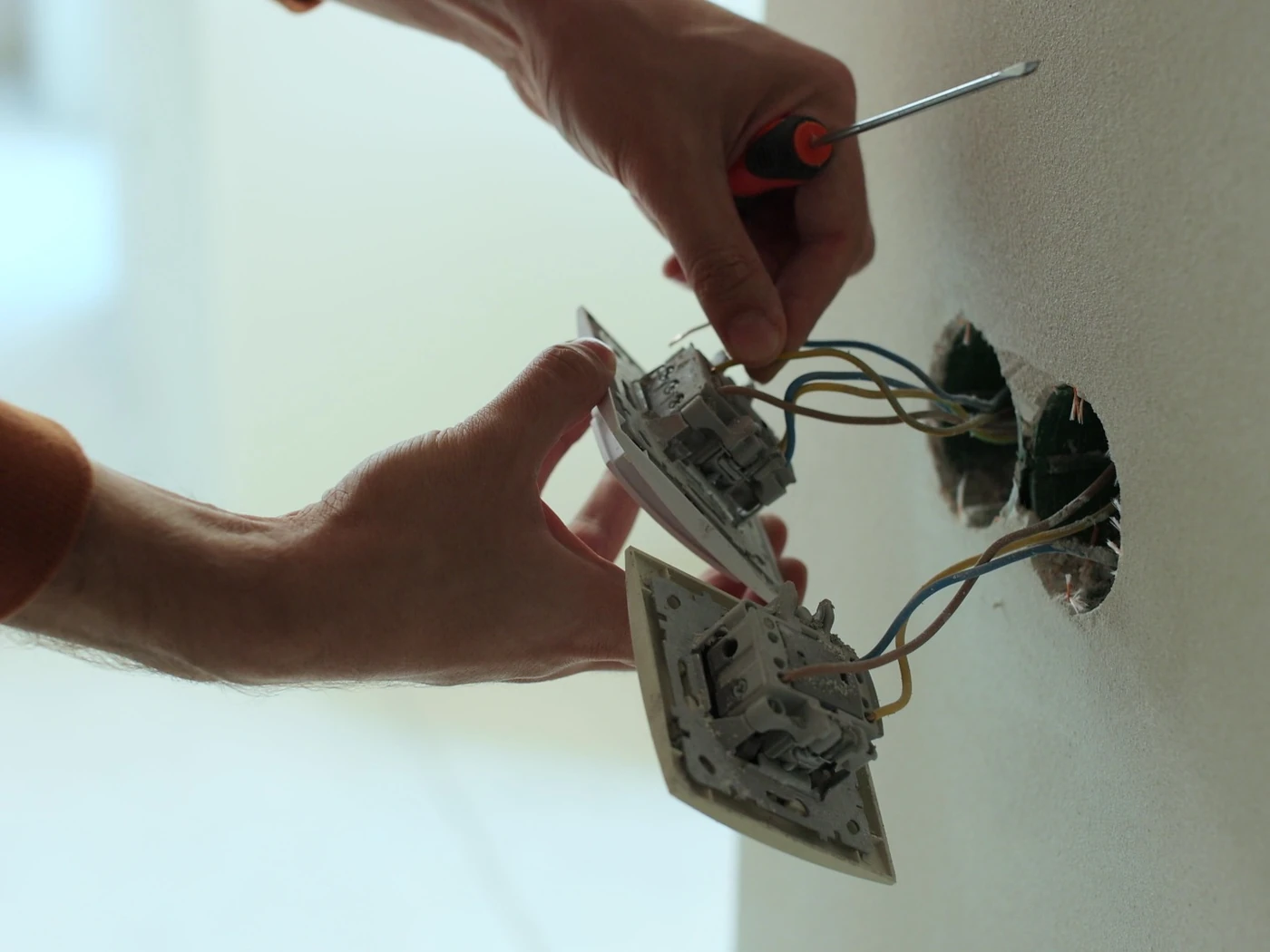 Electrician repairing plug point wiring and electrical connections in Gauteng