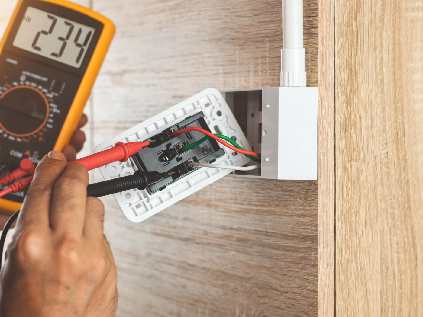 Electrician testing plug point circuit for tripping power and earth leakage repairs