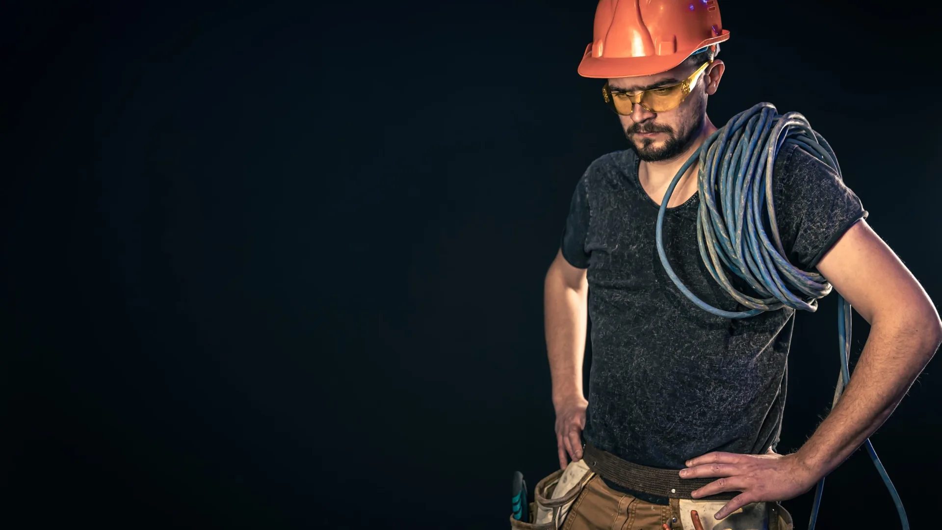 Electrician carrying electrical cable for electrical services in Gauteng