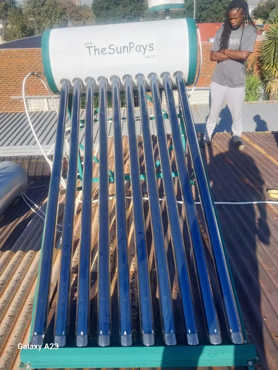 100 Litre Evacuated Tube Solar Geyser Conversion – Benefits of Correct Solar Geyser Installation solar geyser plumber inspecting evacuated tubes during a 100 litre solar geyser installation