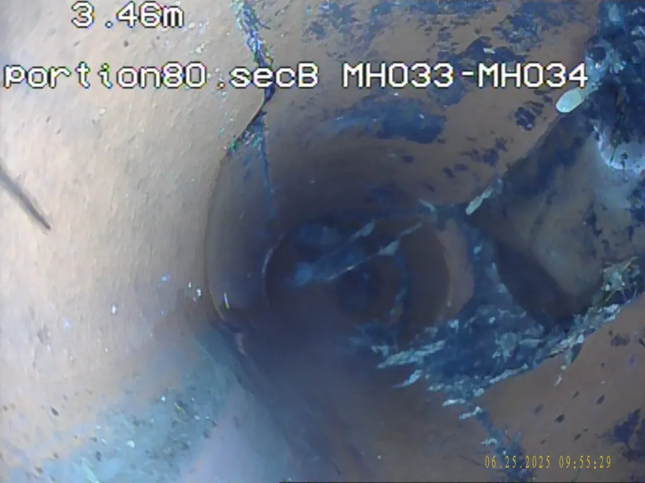 Blocked drain inspection chamber opened for professional diagnosis