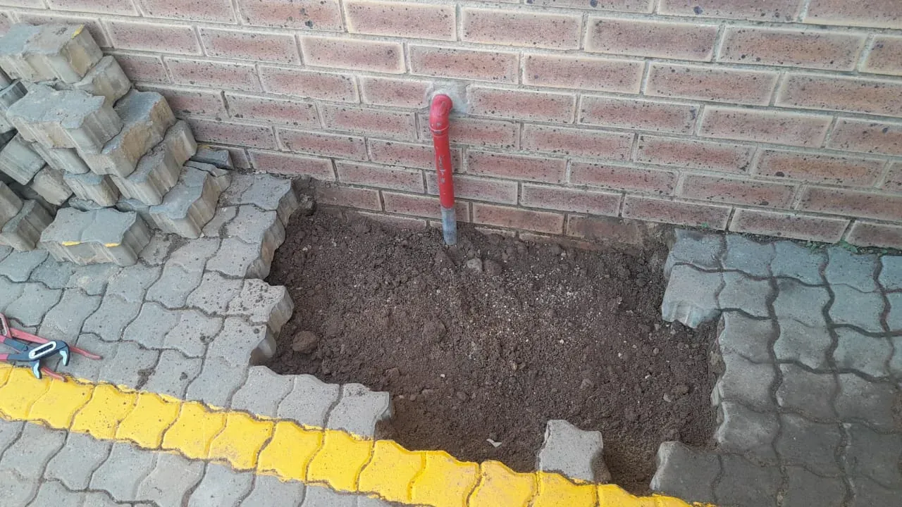 Pressure gauge connected during a professional leak detection pressure test
